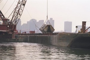 mechanical dredge working on the water